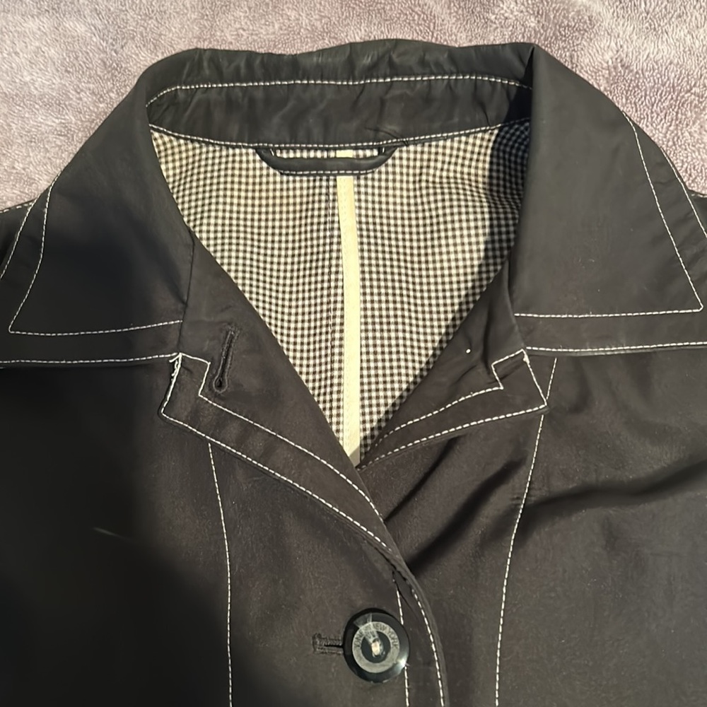 Anne Klein Sport. Woman’s rain coat. Size Small. Black with white stitching.
